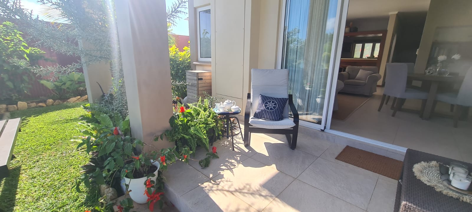 Leafy private verandah beside the living space
